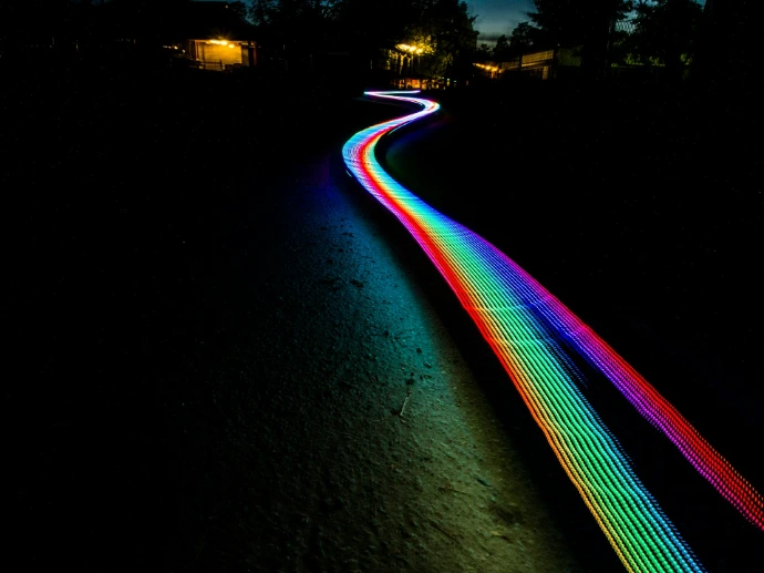 multicolored light passage in dark area